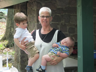 Ben and Nathan with Reverend Pamela at their baptism